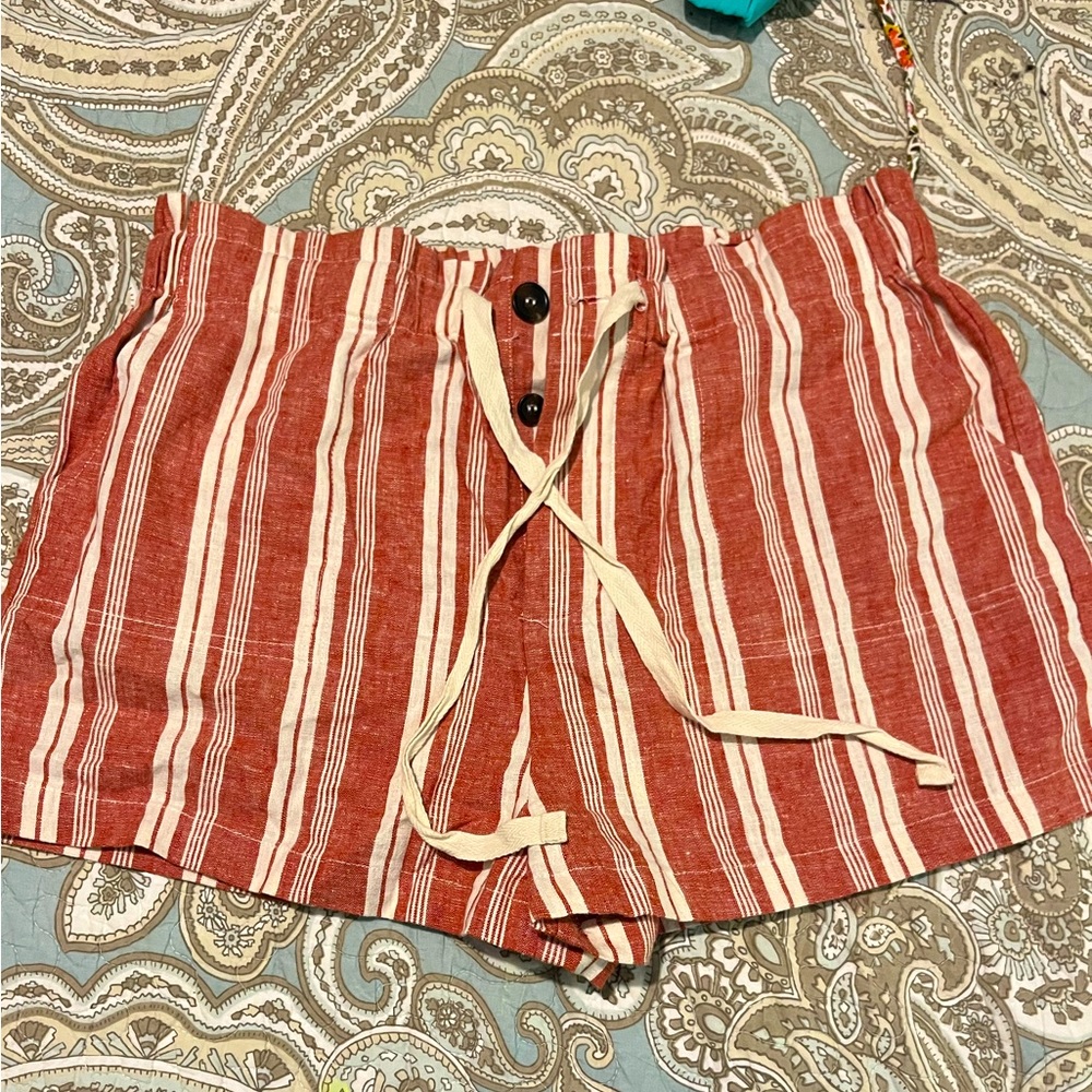 Forever 21 rust colored shorts with white stripes. Size Large.